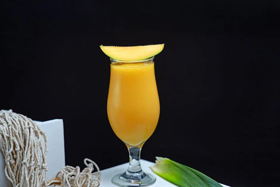 Vibrant mango smoothie served in a glass, perfect for a healthy refreshment.
