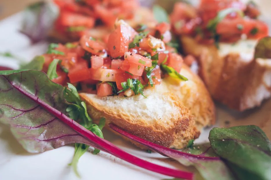 Close-up of fresh bruschetta topped with tomatoes and herbs, ideal for meal ideas.